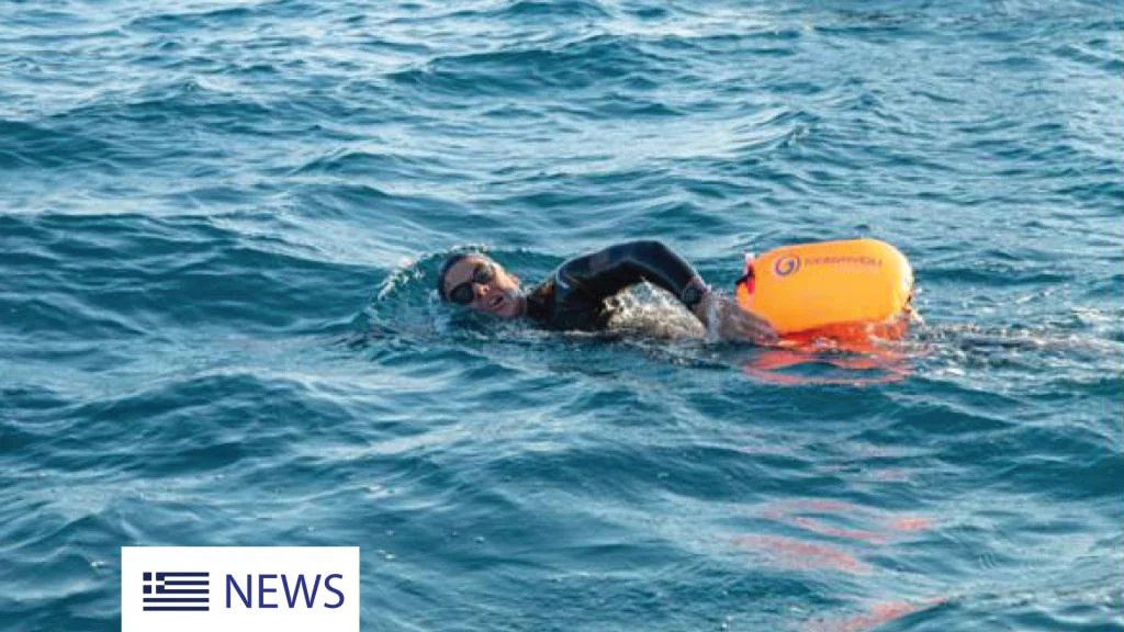 man swimming in the sea